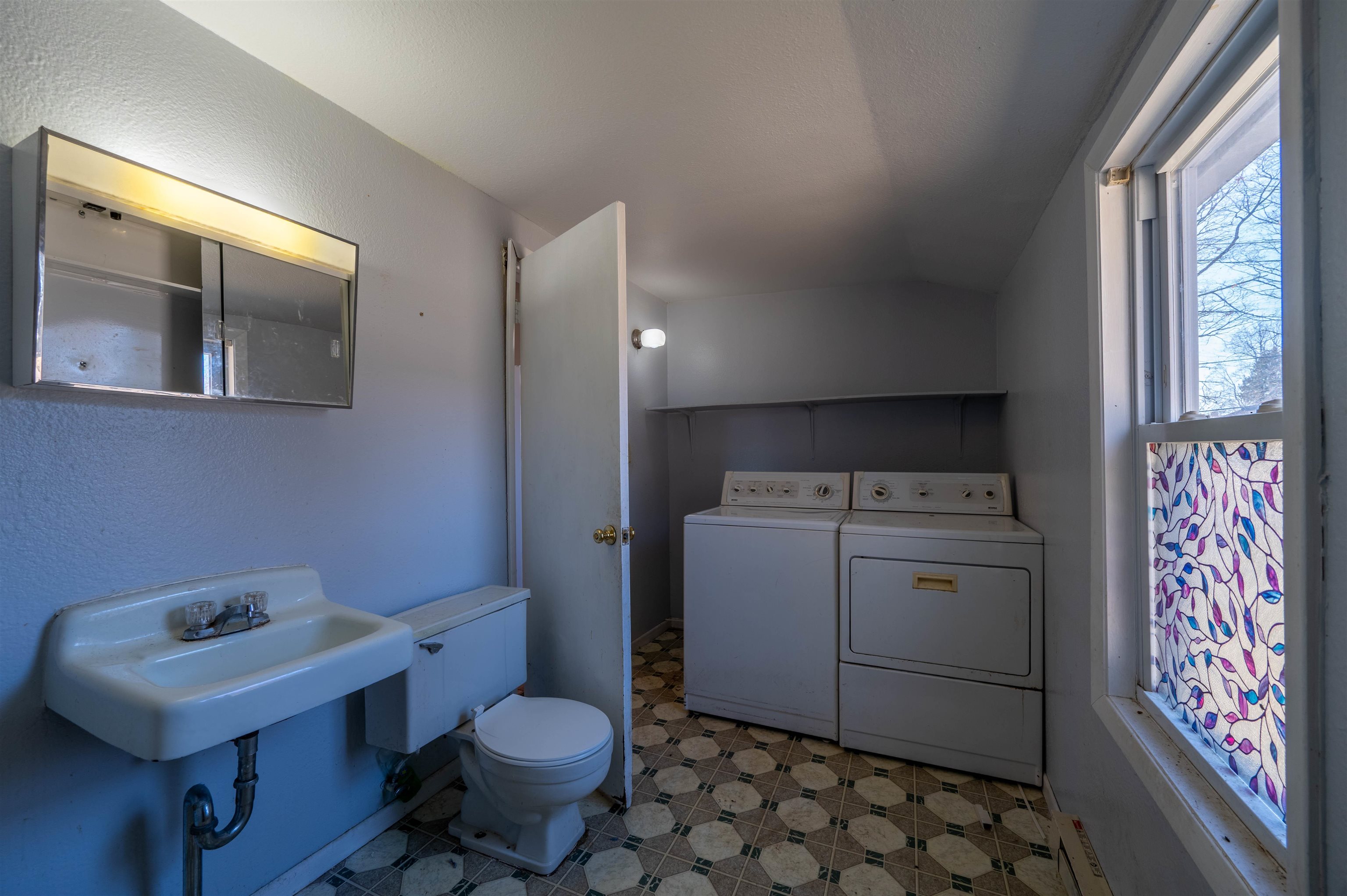 502 East Brayton Road Mount Morris, IL 61054 - Photo 11 of 19 a bathroom with a sink toilet and window
