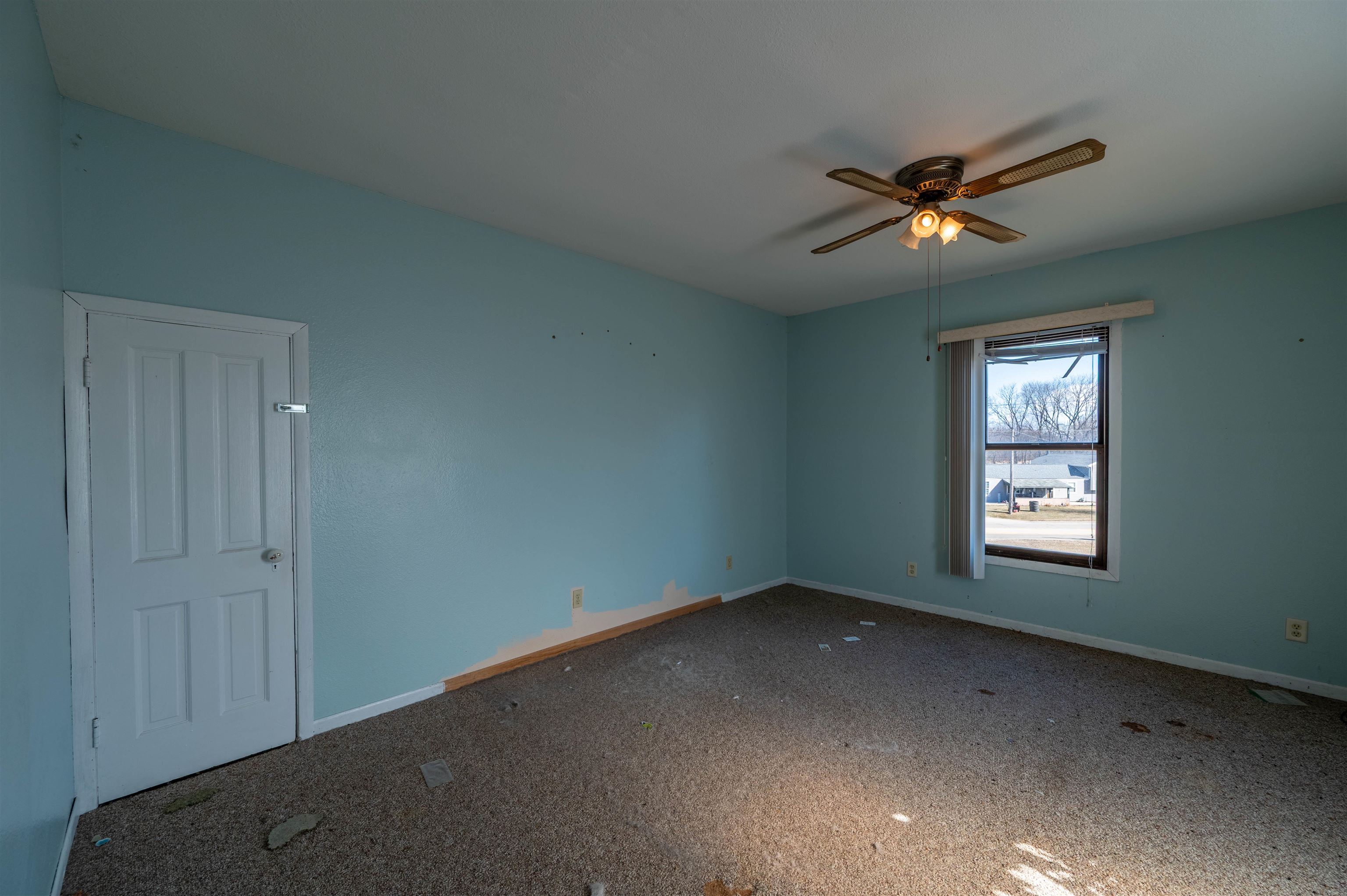 502 East Brayton Road Mount Morris, IL 61054 - Photo 17 of 19 a view of a big room with windows and chandelier fan