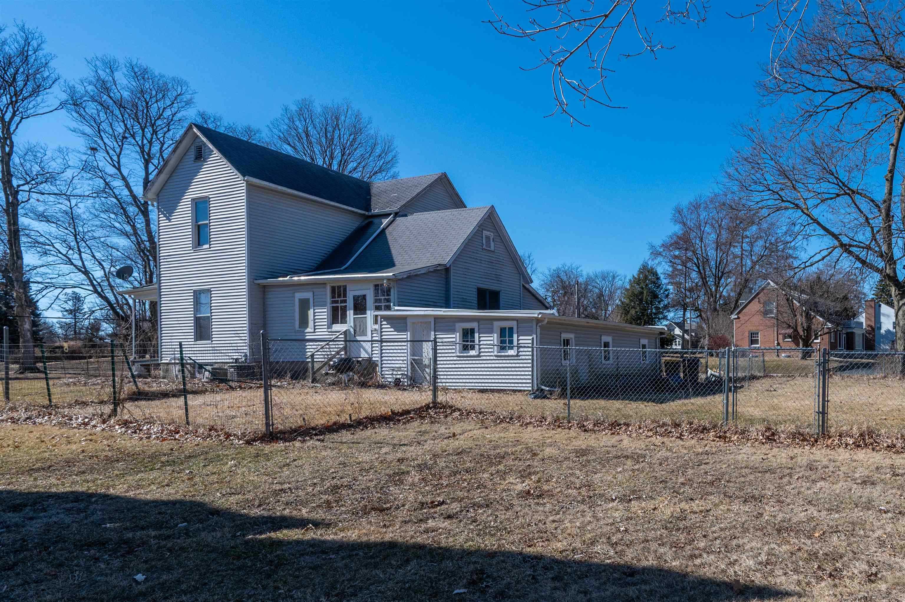 502 East Brayton Road Mount Morris, IL 61054 - Photo 5 of 19 a view of a house with a yard covered in snow