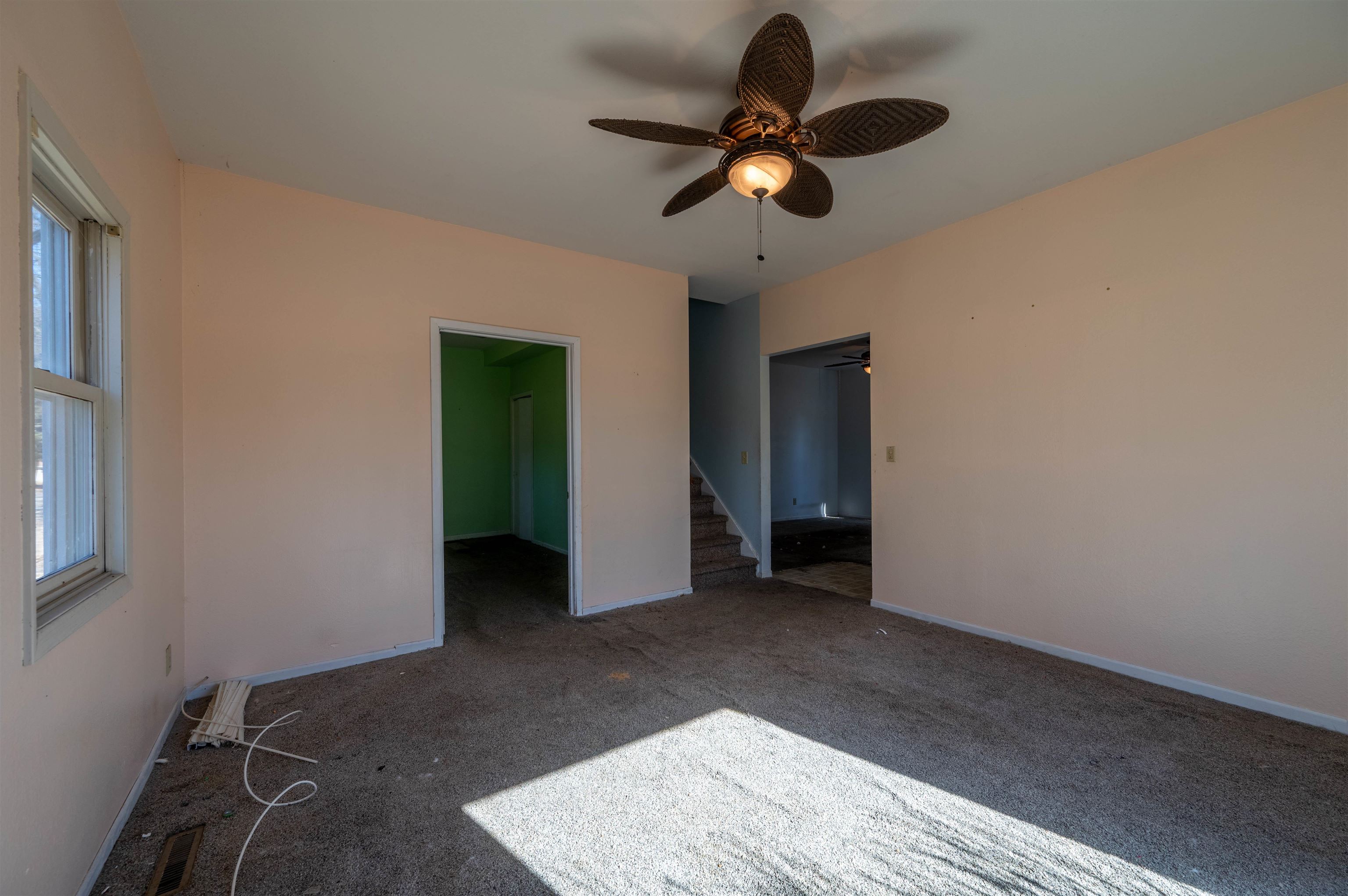 502 East Brayton Road Mount Morris, IL 61054 - Photo 6 of 19 an empty room with closet and chandelier fan