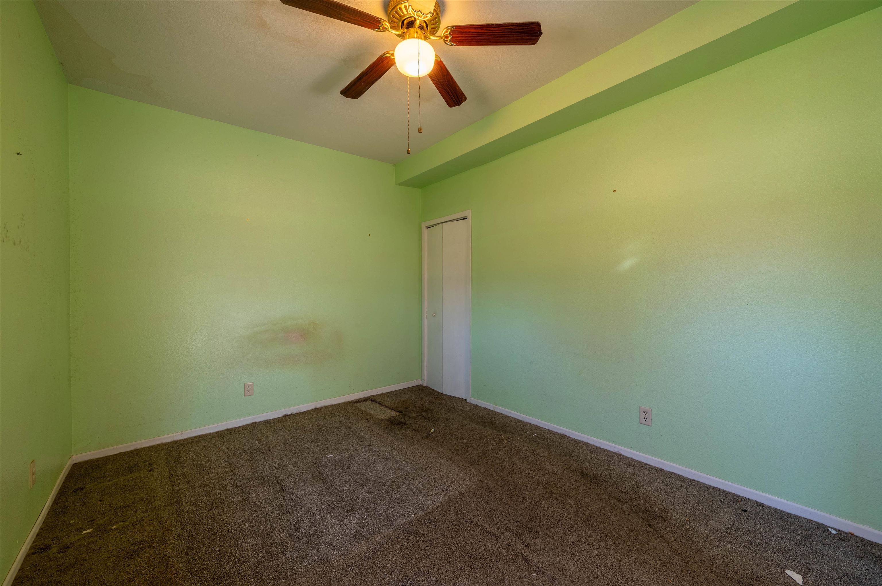 502 East Brayton Road Mount Morris, IL 61054 - Photo 7 of 19 an empty room with a window and a fan
