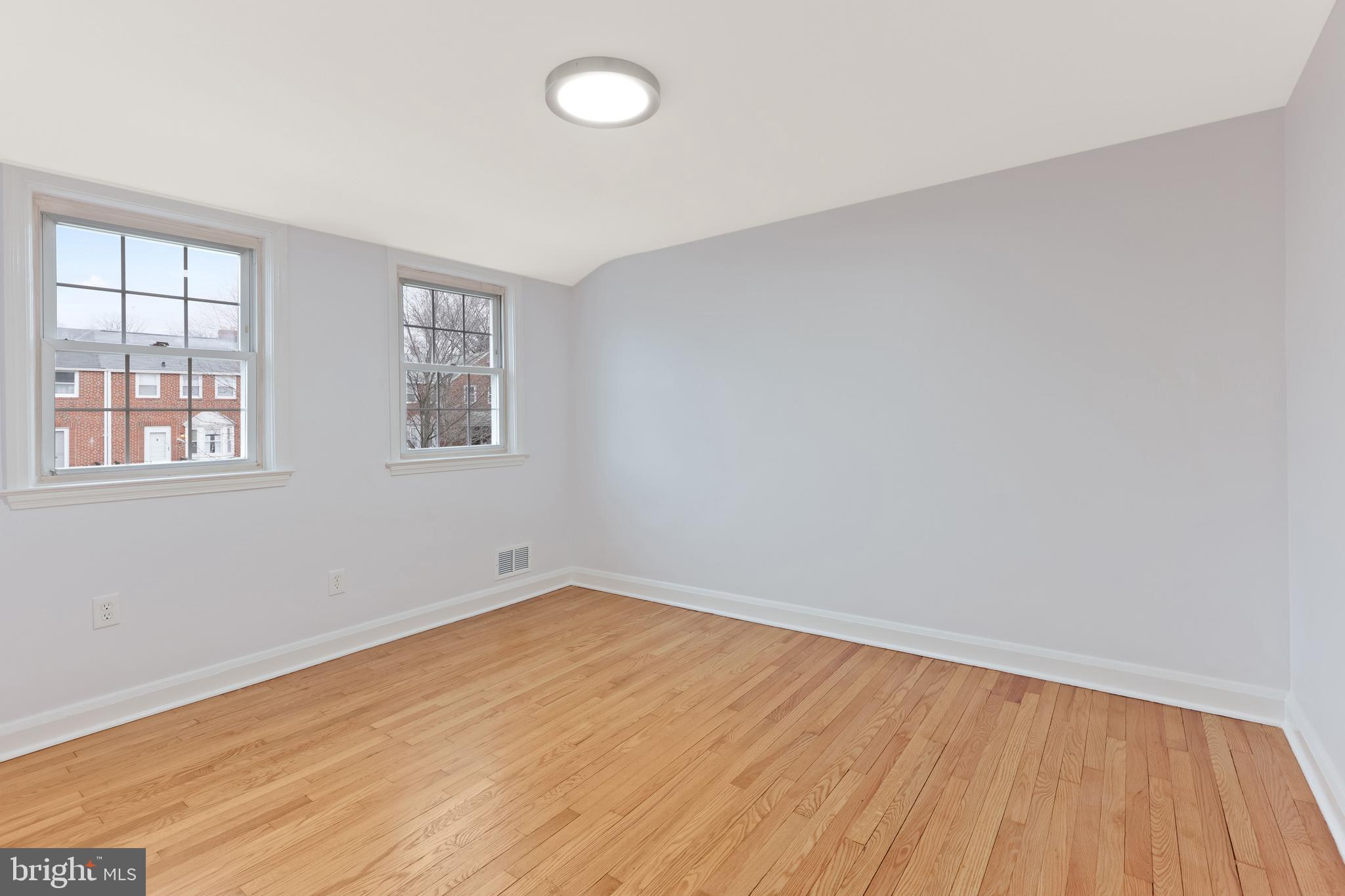 1667 Hardwick Road Towson, MD 21286 - Photo 16 of 34 an empty room with wooden floor and windows