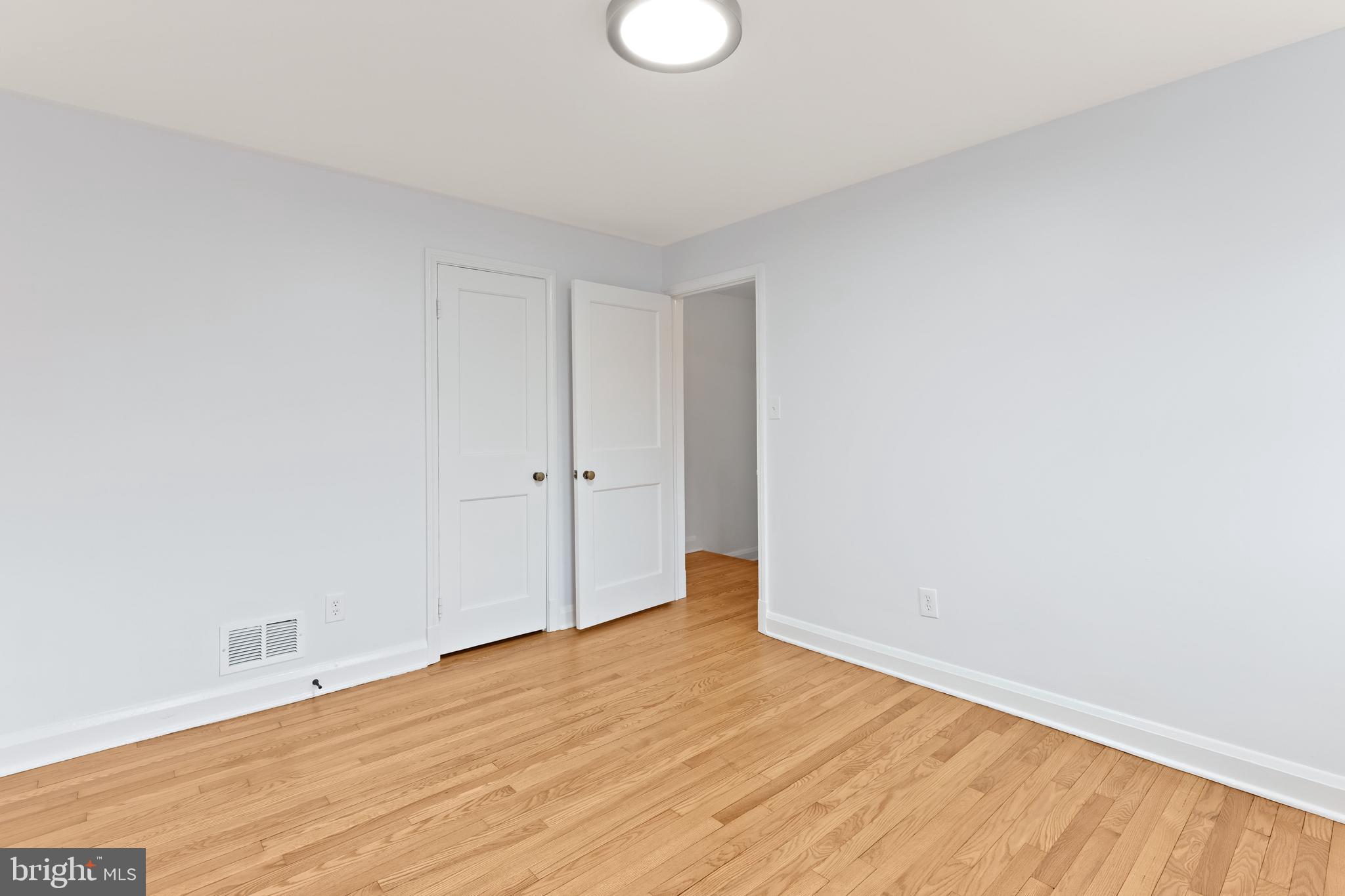 1667 Hardwick Road Towson, MD 21286 - Photo 17 of 34 a view of an empty room with wooden floor