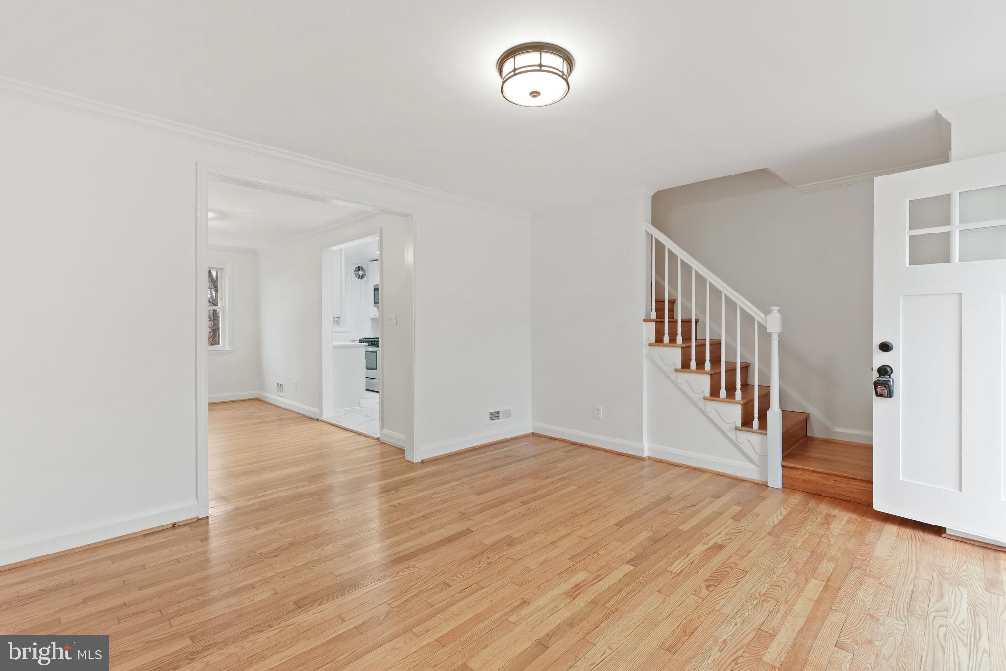 1667 Hardwick Road Towson, MD 21286 - Photo 2 of 34 a view of an empty room with wooden floor