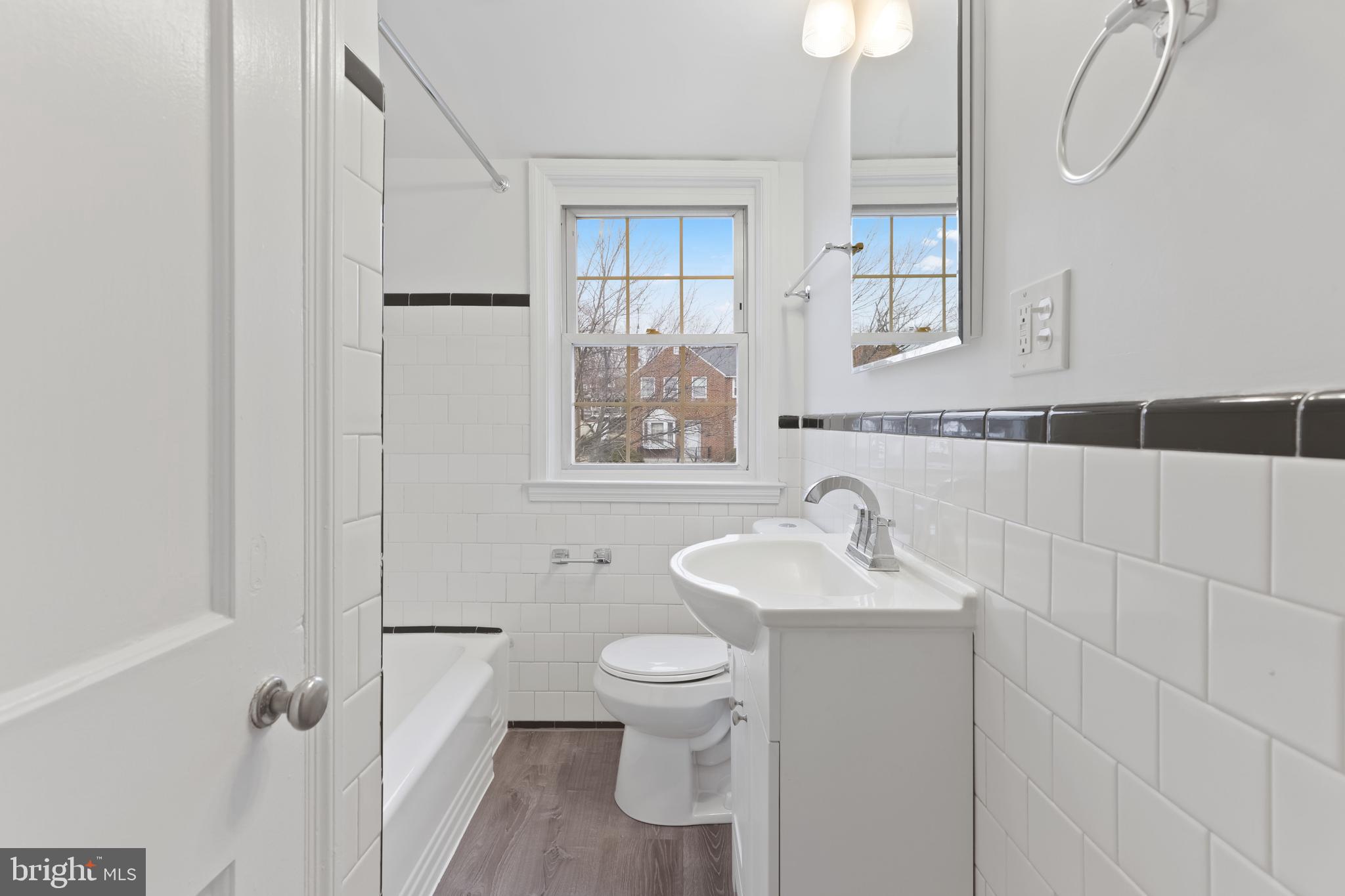1667 Hardwick Road Towson, MD 21286 - Photo 21 of 34 a bathroom with a sink toilet and a mirror