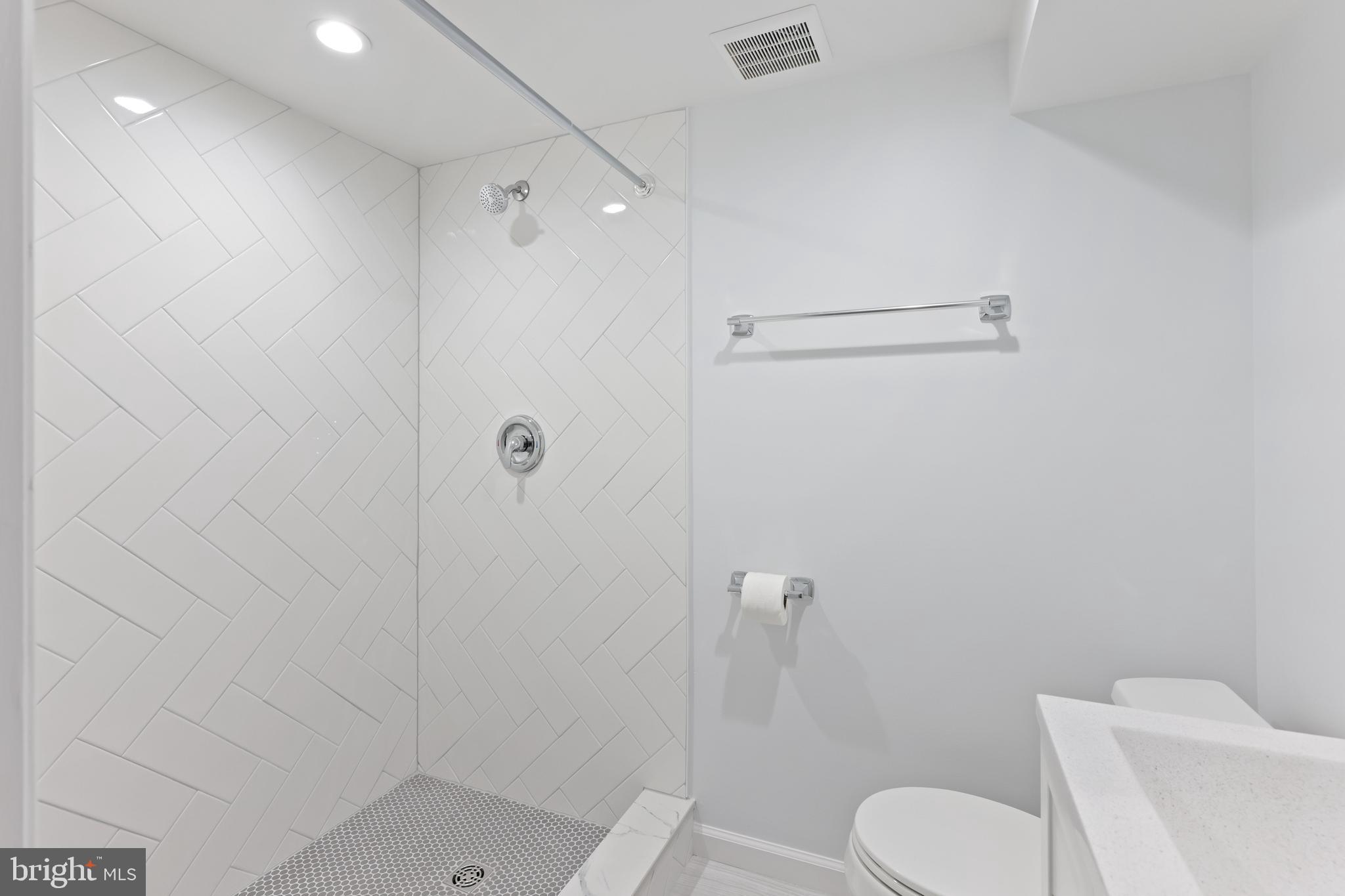 1667 Hardwick Road Towson, MD 21286 - Photo 25 of 34 a bathroom with a toilet and a shower