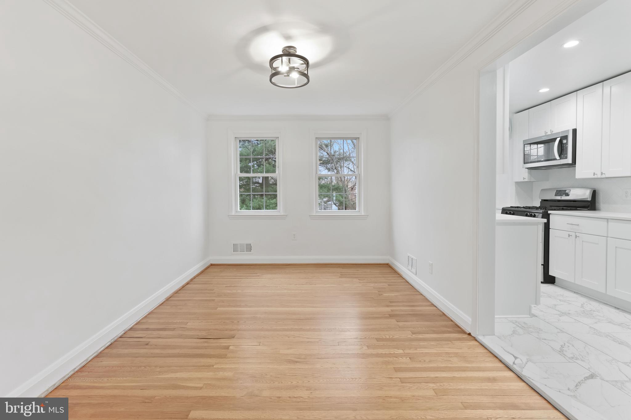 1667 Hardwick Road Towson, MD 21286 - Photo 4 of 34 wooden floor in an empty room with a window