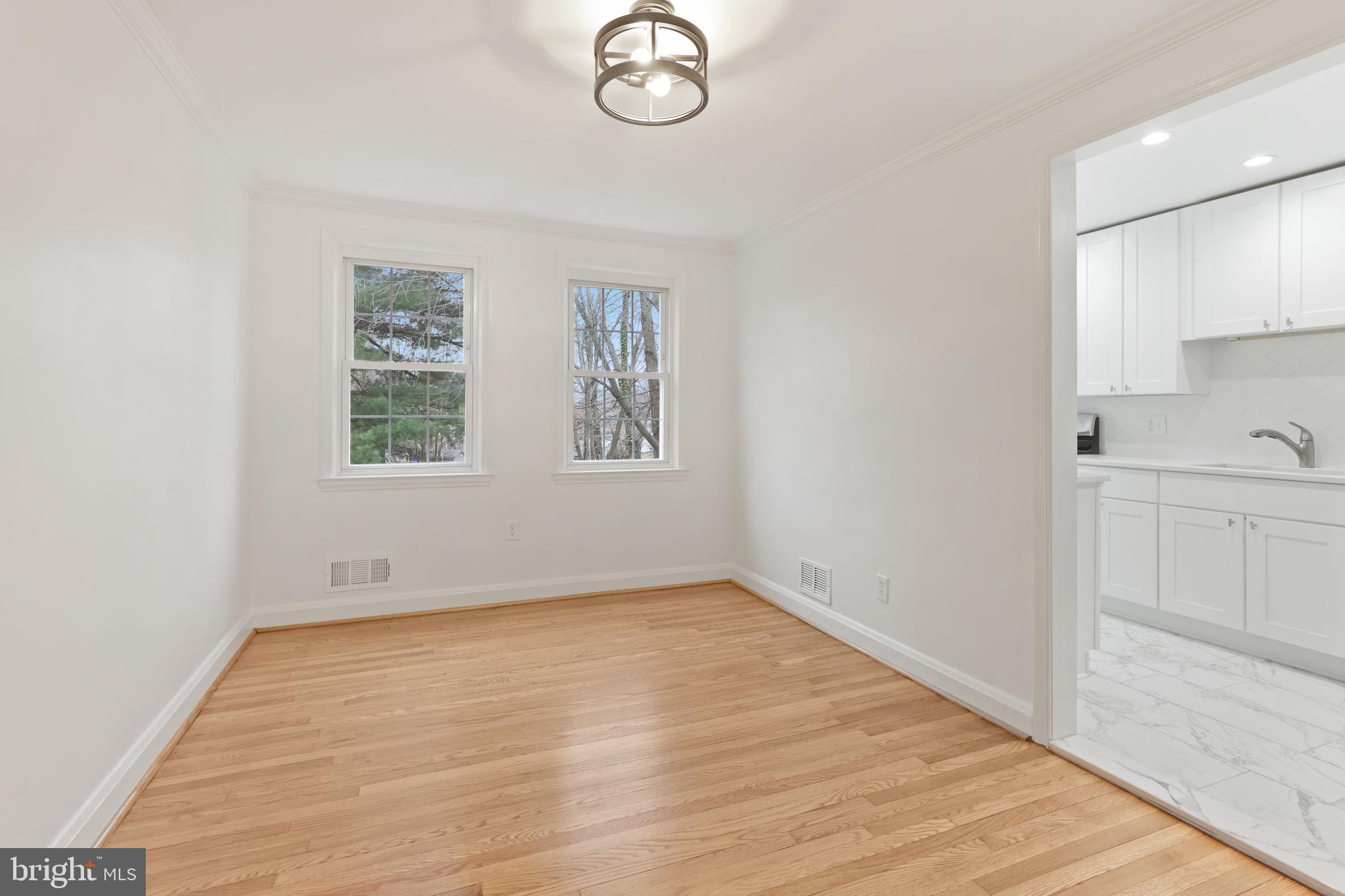 1667 Hardwick Road Towson, MD 21286 - Photo 7 of 34 wooden floor in an empty room with a window