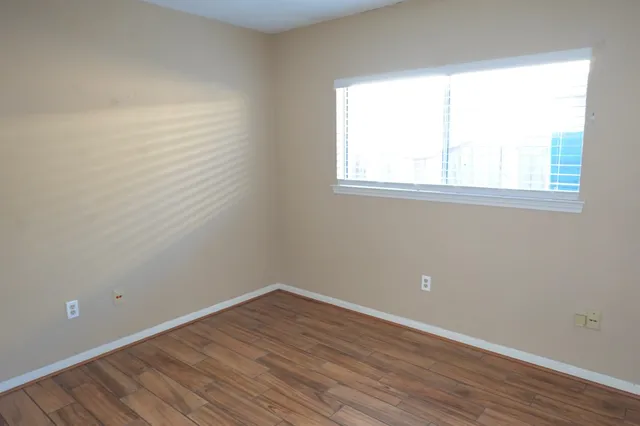 a view of a backyard with a porch and a fountain