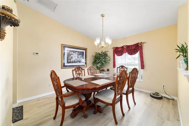 a kitchen with stainless steel appliances kitchen island granite countertop a sink stove and refrigerator