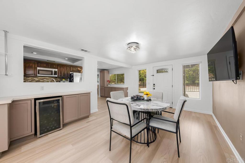 1661 Grove Road El Cajon, CA 92020 - Photo 11 of 44 a view of a dining room with furniture and wooden floor