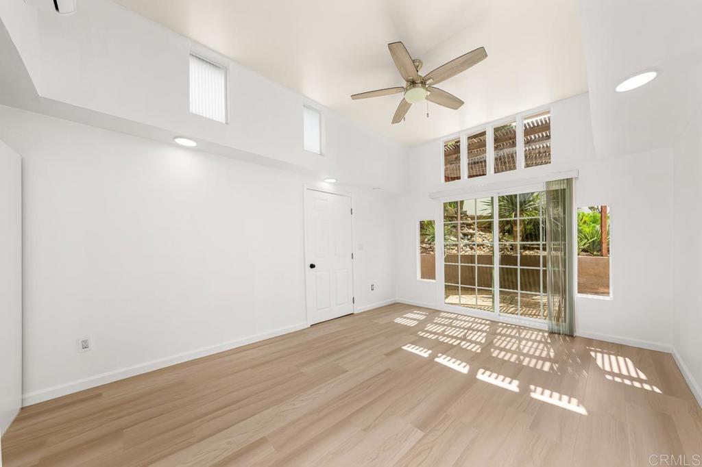 1661 Grove Road El Cajon, CA 92020 - Photo 15 of 44 a view of a livingroom with a ceiling fan and wooden floor