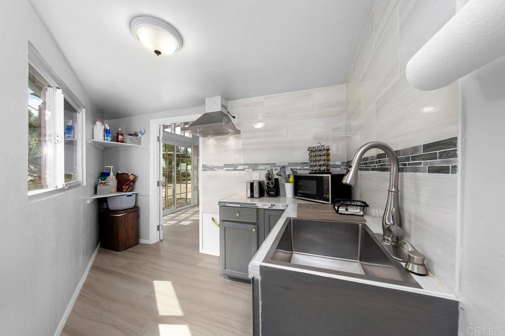 1661 Grove Road El Cajon, CA 92020 - Photo 17 of 44 a kitchen with refrigerator and window