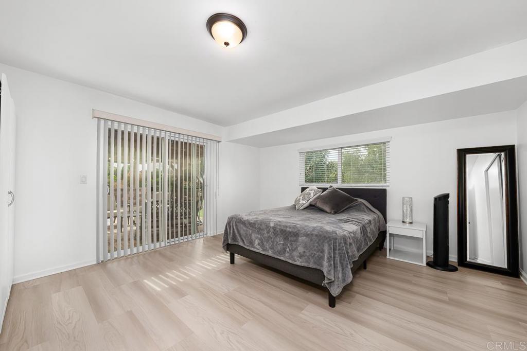 1661 Grove Road El Cajon, CA 92020 - Photo 22 of 44 a bedroom with a bed and a large window