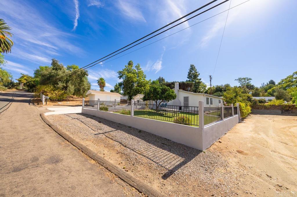 1661 Grove Road El Cajon, CA 92020 - Photo 29 of 44 a swimming pool with outdoor seating and plants