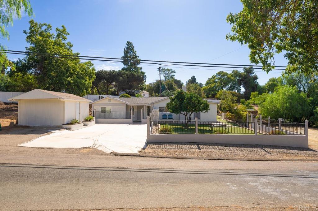 1661 Grove Road El Cajon, CA 92020 - Photo 30 of 44 a view of a yard and front view of a house