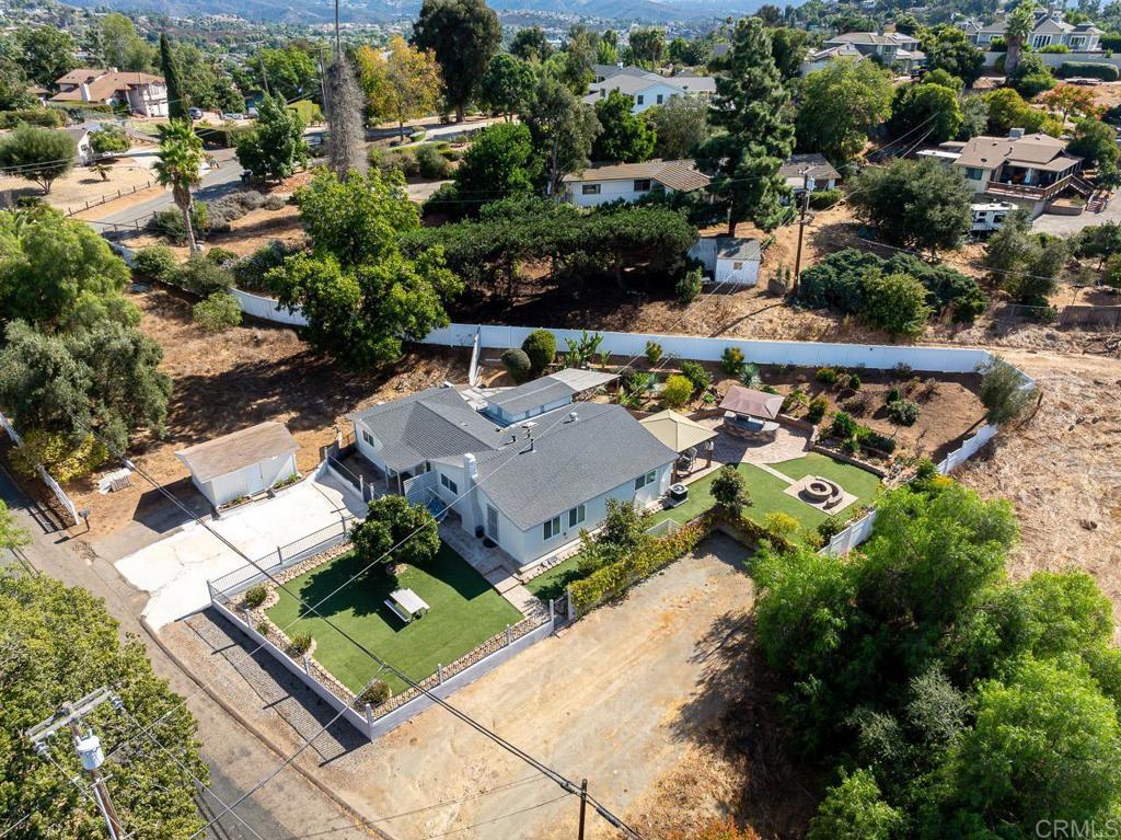 1661 Grove Road El Cajon, CA 92020 - Photo 31 of 44 an aerial view of multiple houses with yard