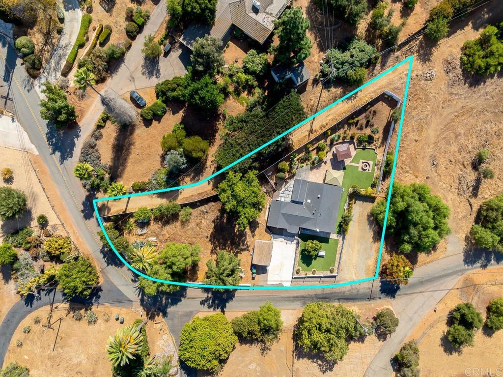 1661 Grove Road El Cajon, CA 92020 - Photo 44 of 44 an aerial view of a house a yard and a wooden bench