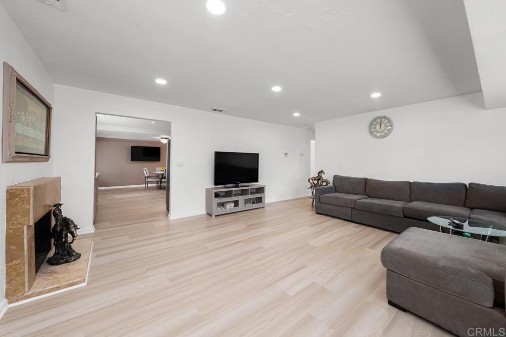 1661 Grove Road El Cajon, CA 92020 - Photo 8 of 44 a living room with furniture and a flat screen tv