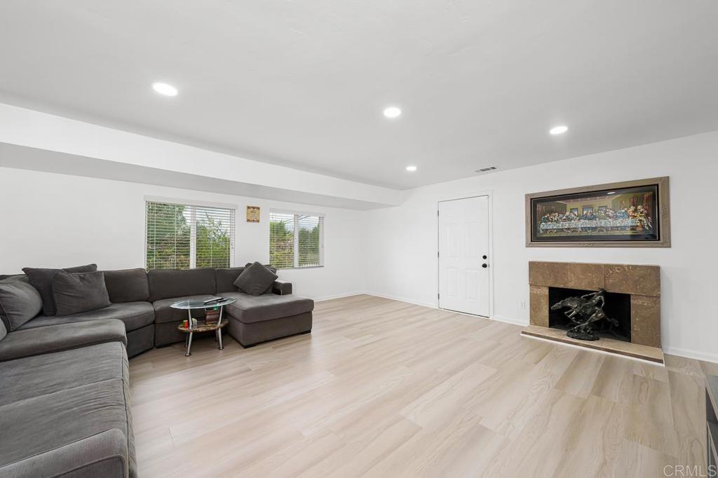 1661 Grove Road El Cajon, CA 92020 - Photo 9 of 44 a living room with furniture and a fireplace