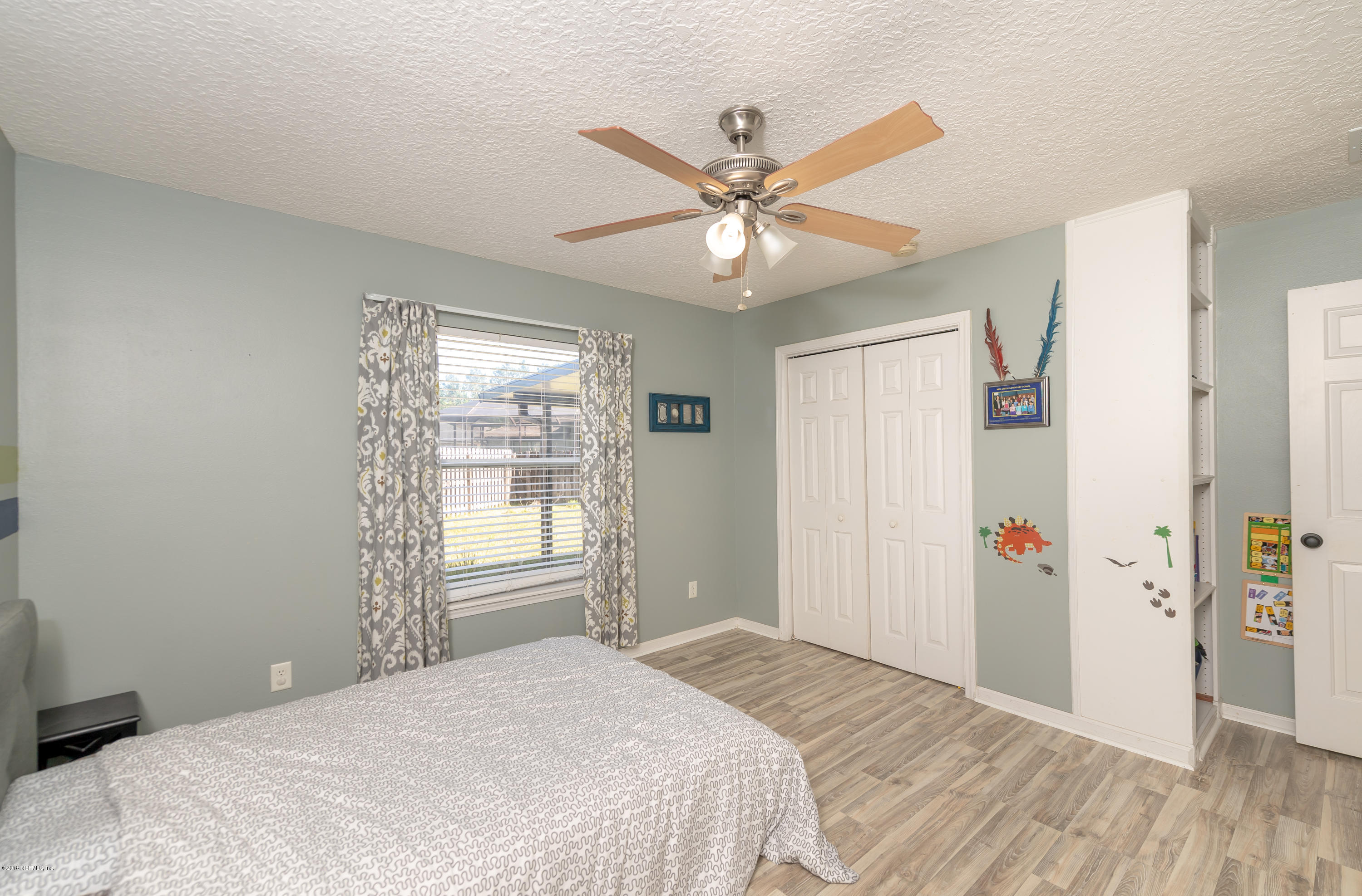 1565 Timber Trace Drive St. Augustine, FL 32092 - Photo 14 of 21 a bedroom with a bed and a window