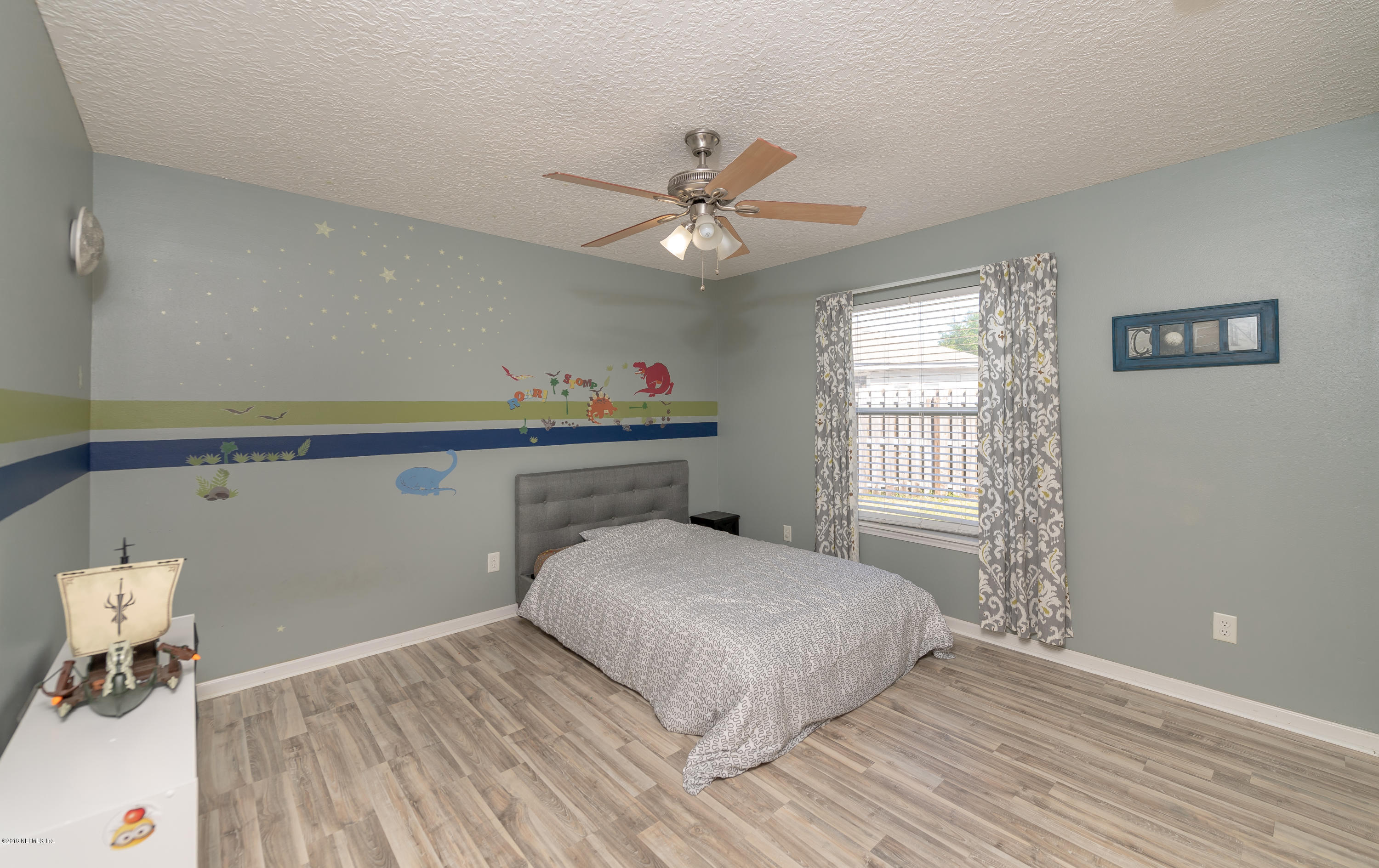 1565 Timber Trace Drive St. Augustine, FL 32092 - Photo 15 of 21 a bedroom with a bed and a window