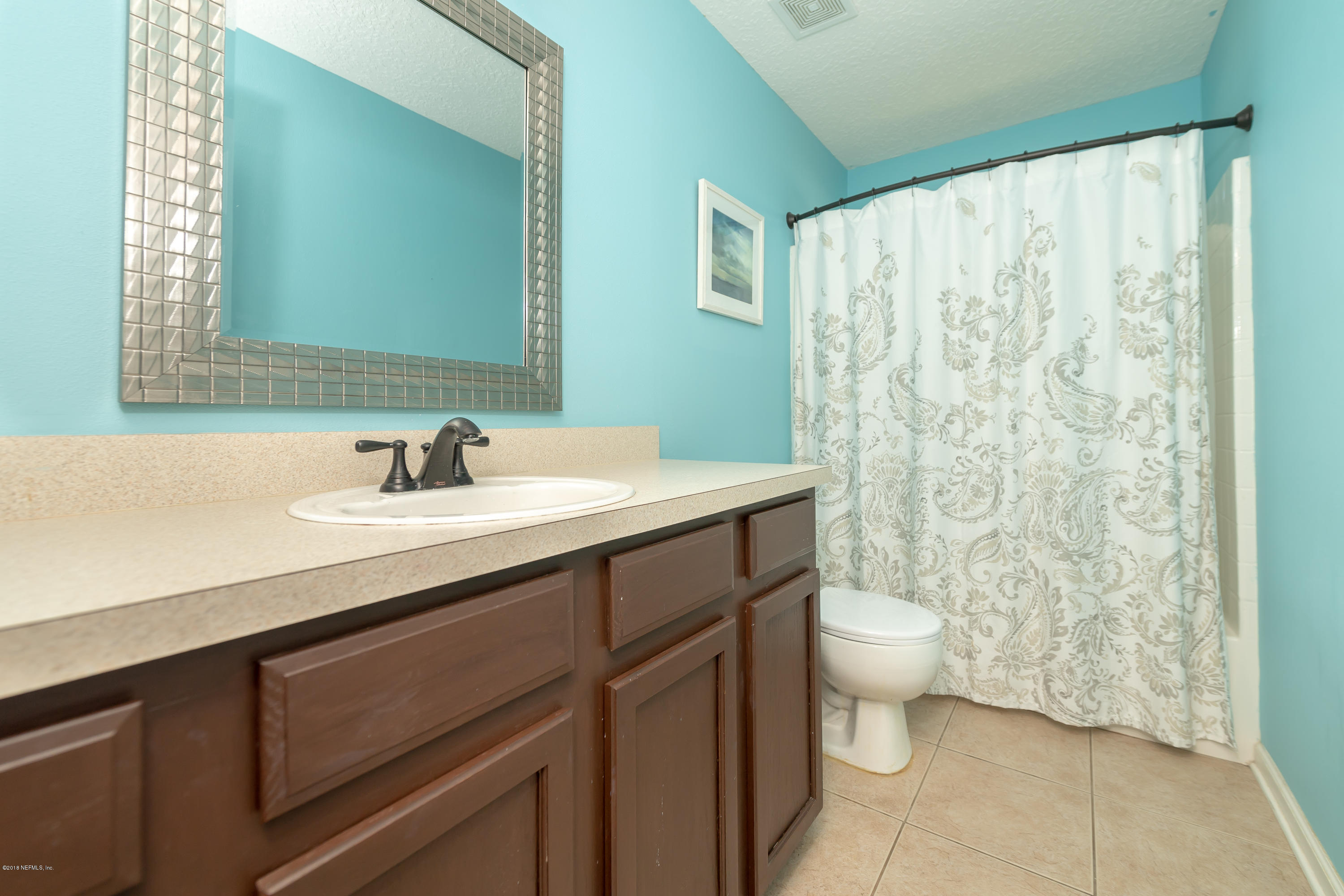 1565 Timber Trace Drive St. Augustine, FL 32092 - Photo 16 of 21 a bathroom with a sink toilet and shower