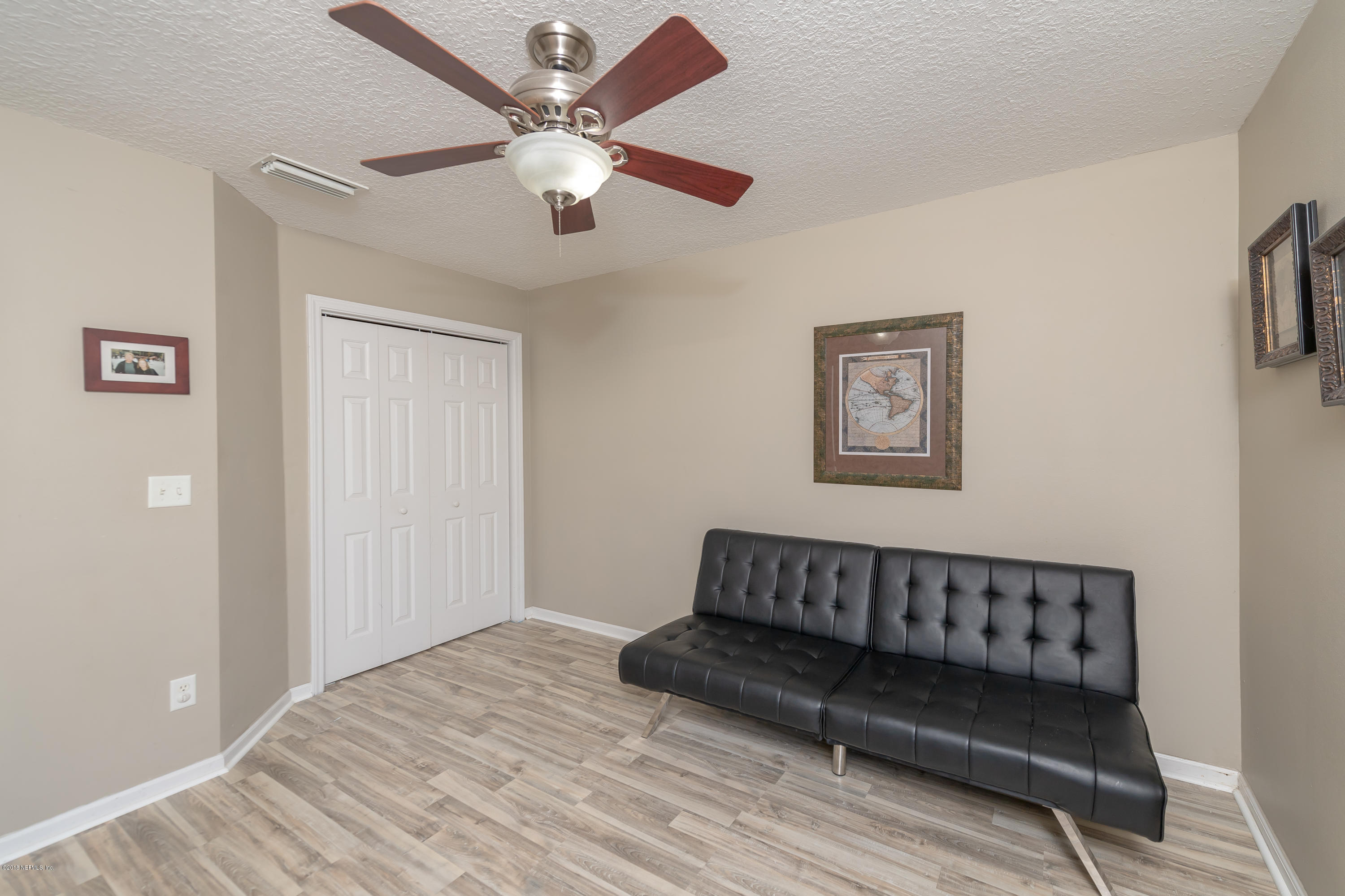 1565 Timber Trace Drive St. Augustine, FL 32092 - Photo 17 of 21 a living room with a couch