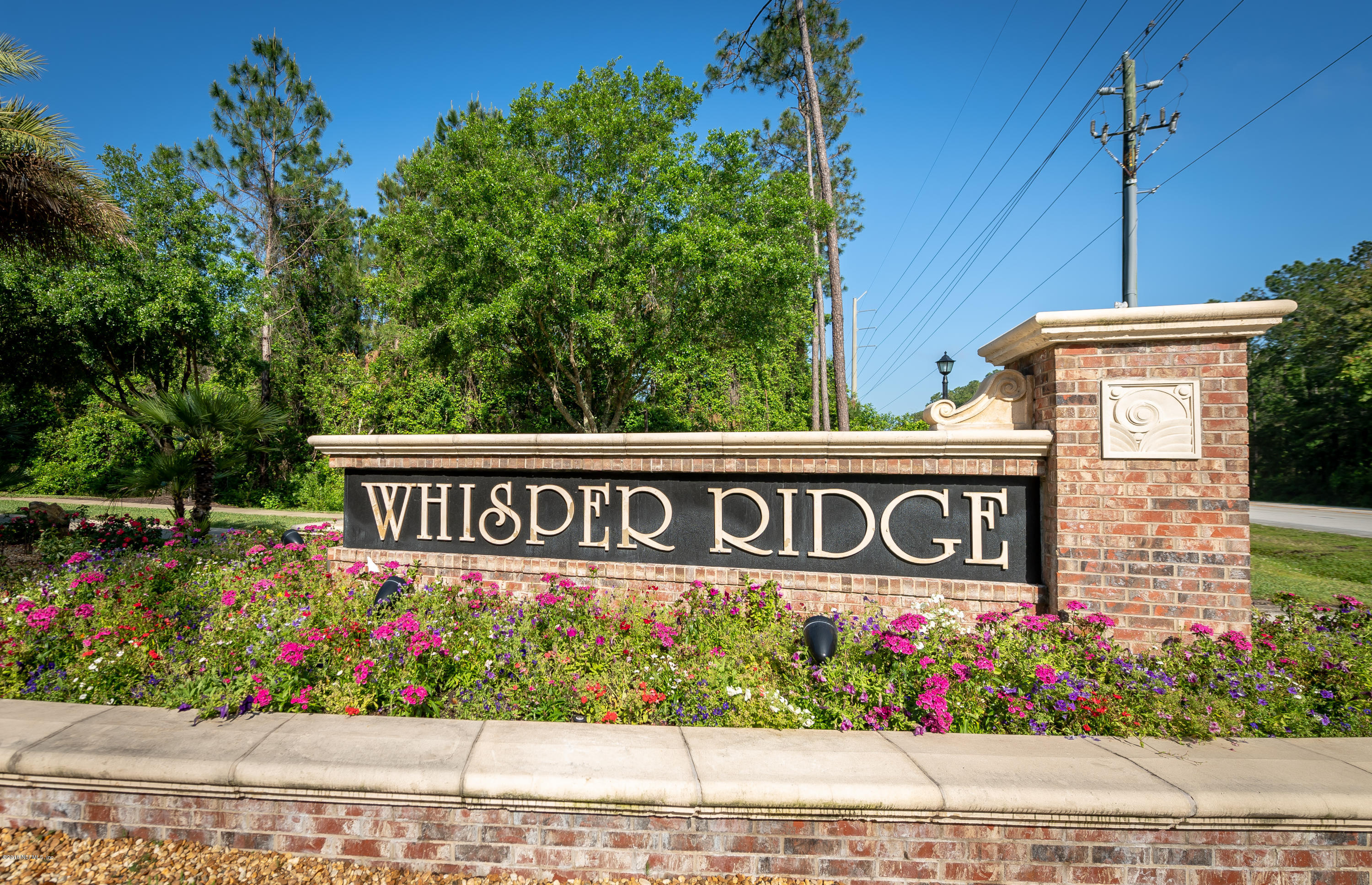 1565 Timber Trace Drive St. Augustine, FL 32092 - Photo 20 of 21 a sign broad in front of flowers