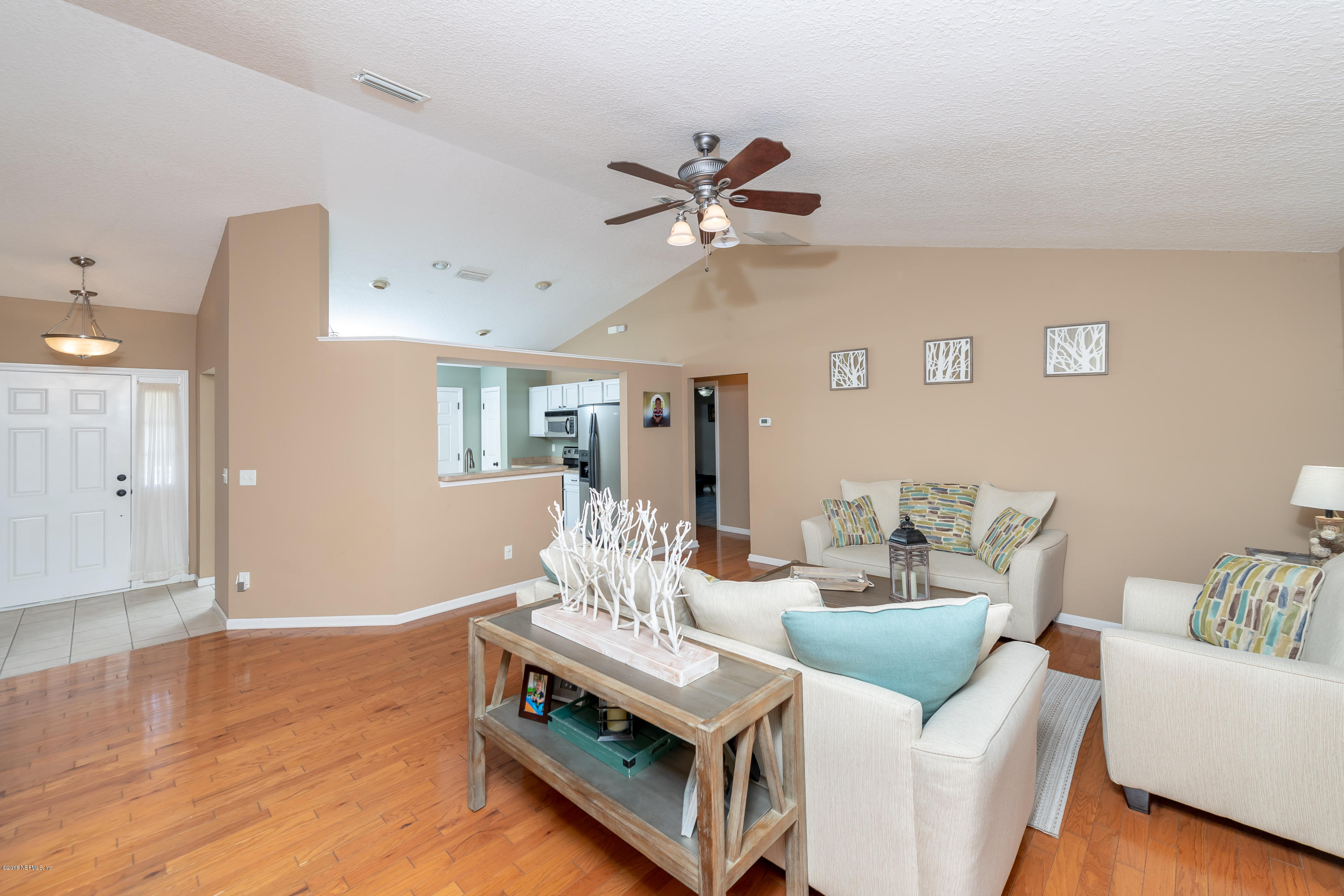 1565 Timber Trace Drive St. Augustine, FL 32092 - Photo 2 of 21 a living room with furniture and a ceiling fan