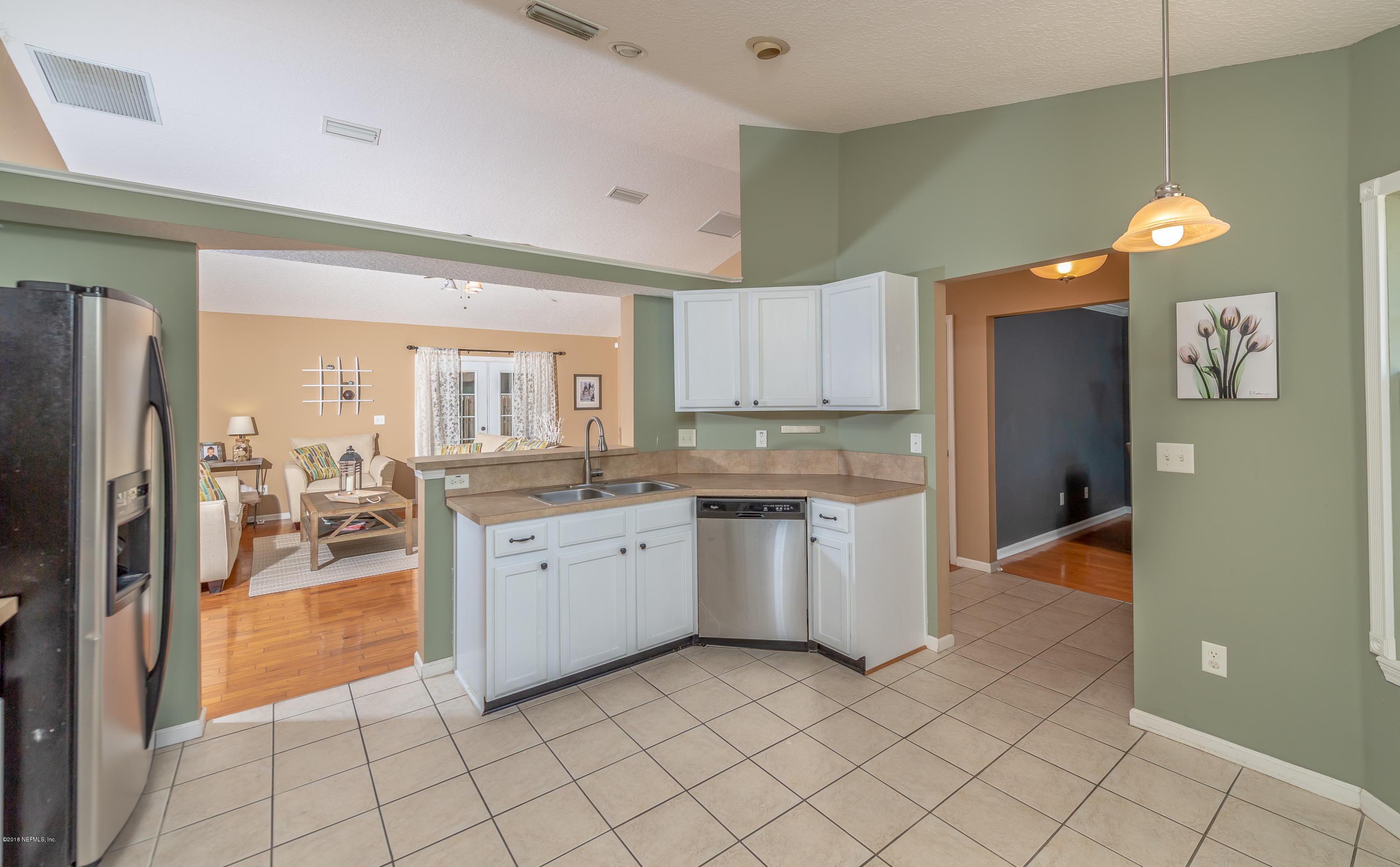 1565 Timber Trace Drive St. Augustine, FL 32092 - Photo 5 of 21 a kitchen with granite countertop cabinets and appliances