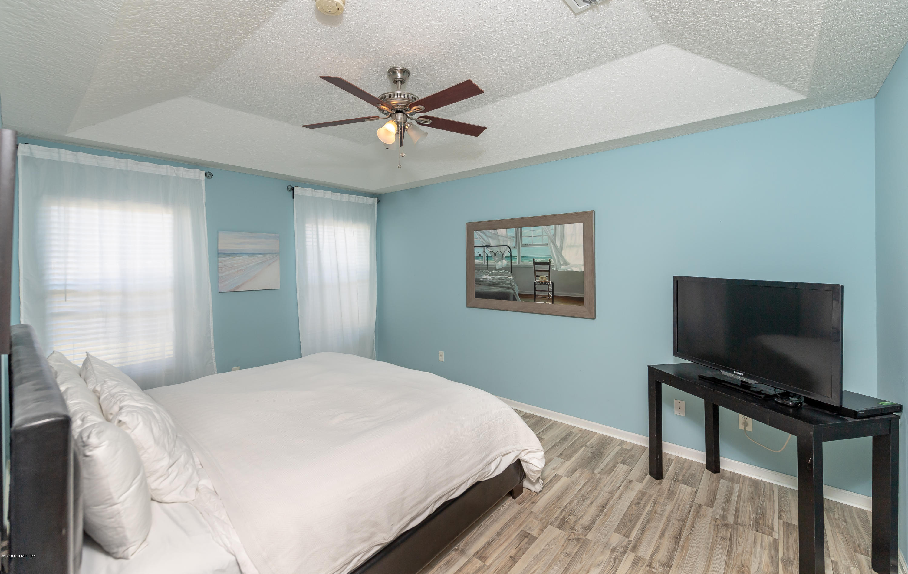 1565 Timber Trace Drive St. Augustine, FL 32092 - Photo 9 of 21 a bedroom with a bed and a flat screen tv