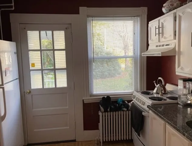 a kitchen with stainless steel appliances a sink a stove and a window
