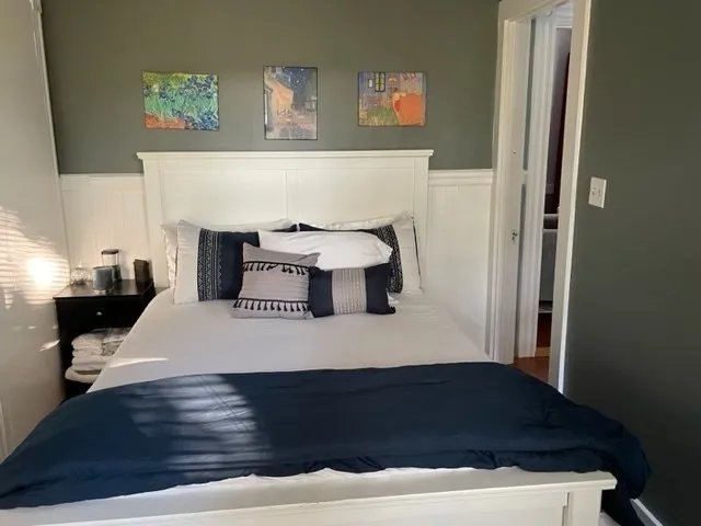 a room with a bed and cabinets