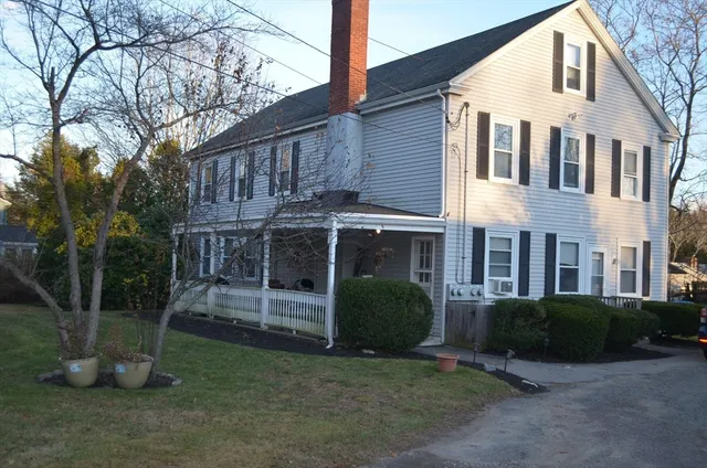 a view of a yard with trees