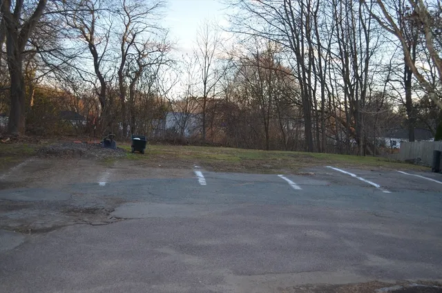 a view of a chair and table in backyard
