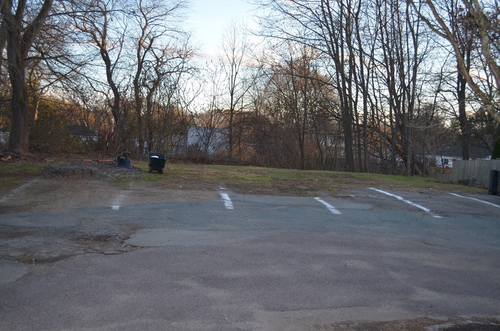 509 Bay Road, Unit 1L Hamilton, MA 01982 - Photo 8 of 10 a view of a yard with trees