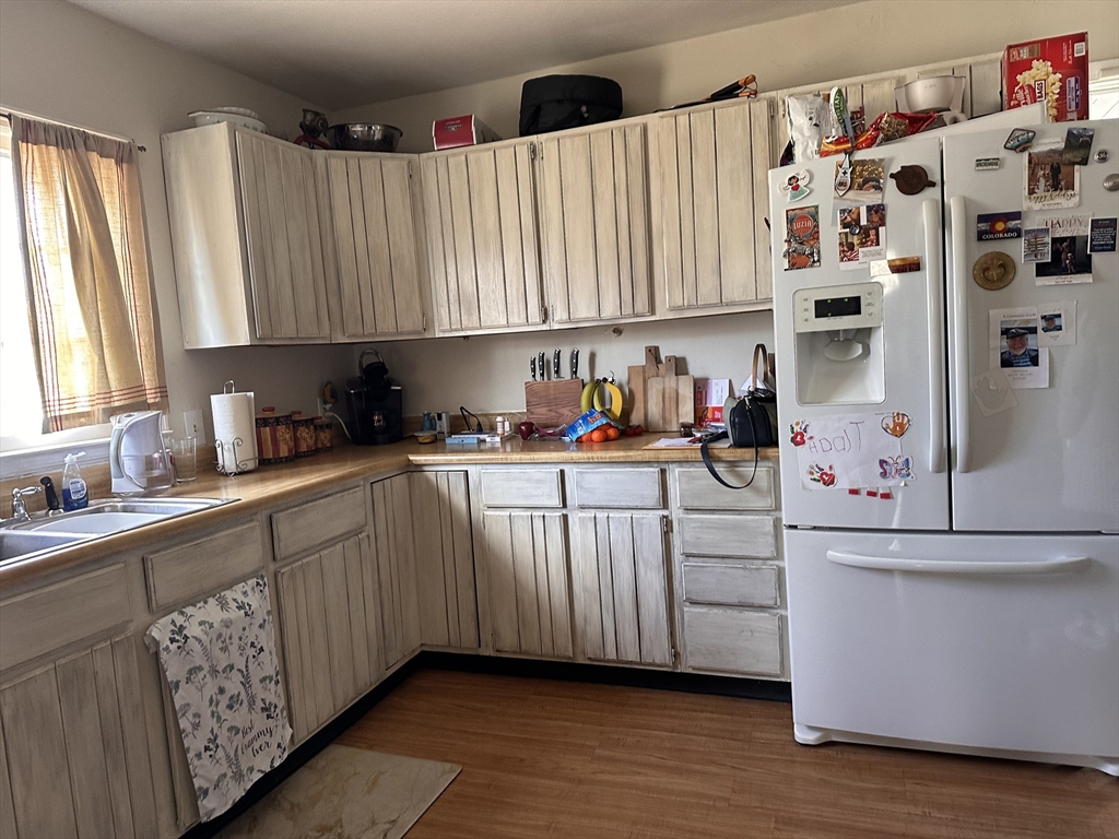 445 Chicopee Street Chicopee, MA 01013 - Photo 14 of 14 a kitchen with stainless steel appliances a white cabinets and a sink