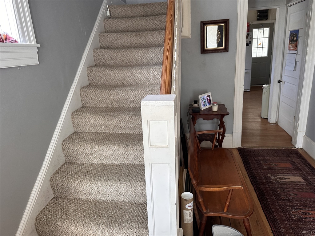 445 Chicopee Street Chicopee, MA 01013 - Photo 10 of 14 a view of staircase with white walls and a window