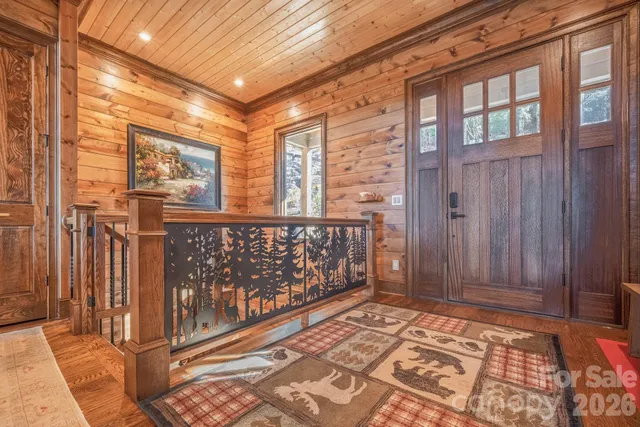 a living room with furniture a fireplace and a table