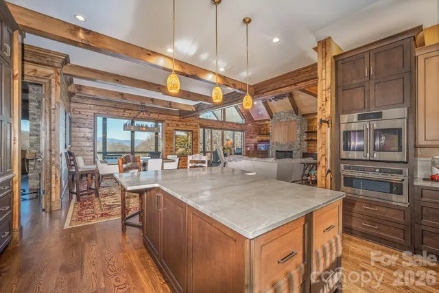 a dining room with a large window and table