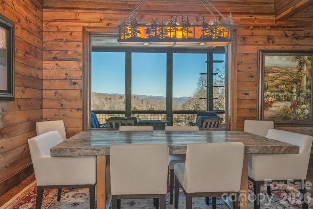 a view of a bedroom with a large bed and large windows