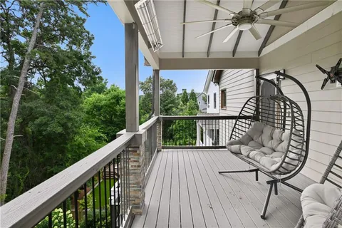 a view of a balcony with a table and chairs