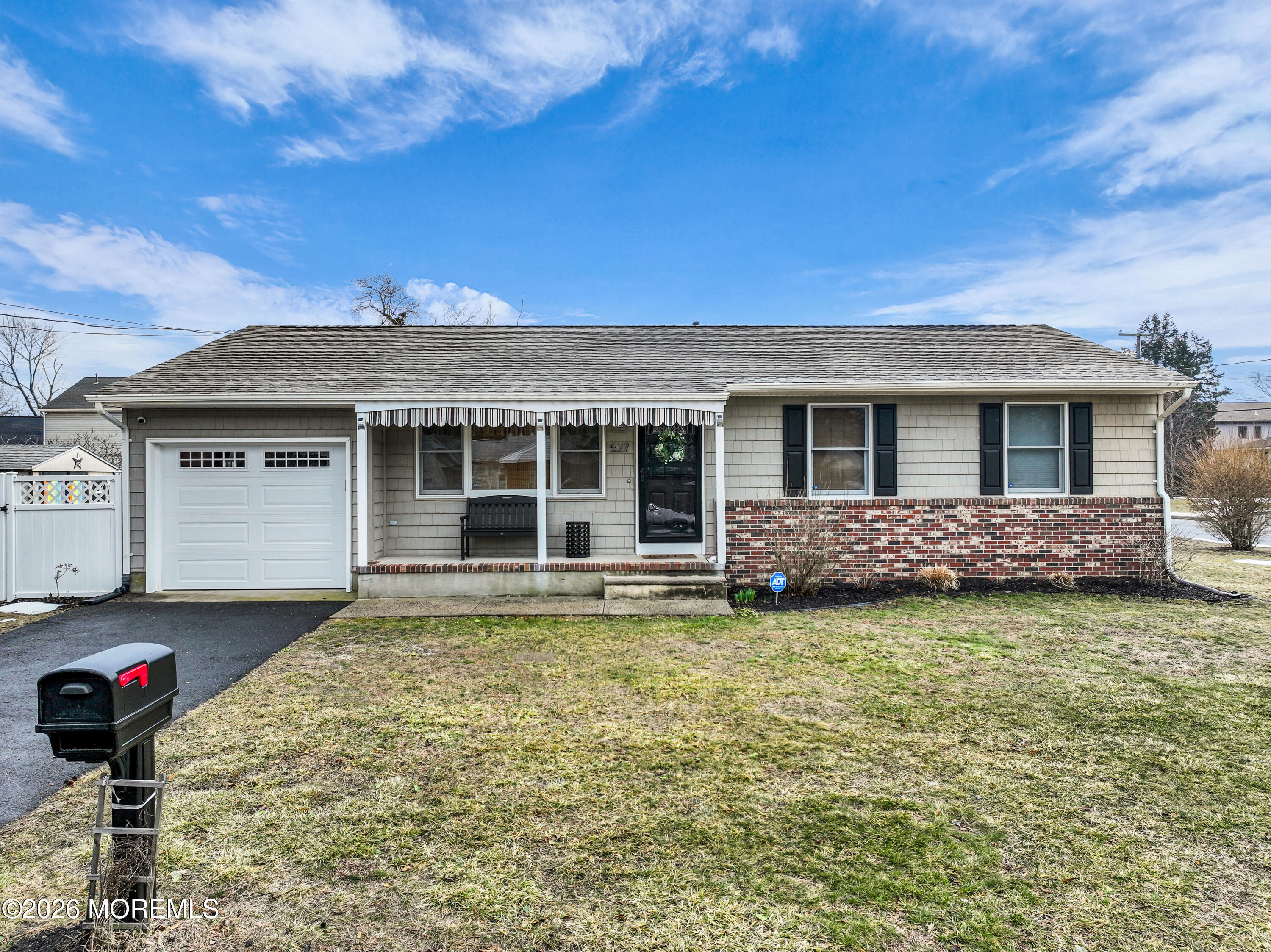 527 Delaware Avenue Point Pleasant, NJ 08742 - Photo 1 of 27 a front view of a house with a garden