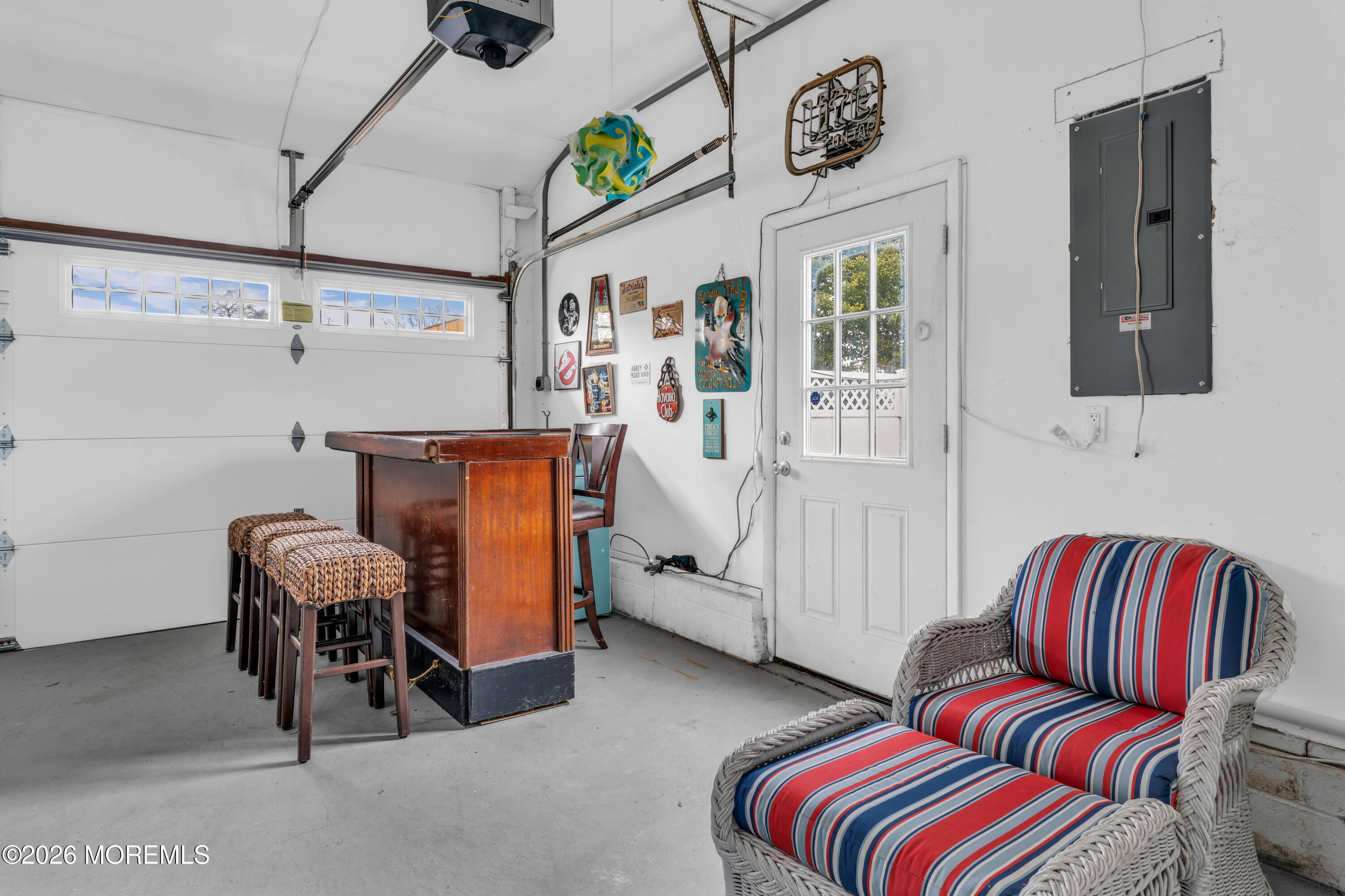 527 Delaware Avenue Point Pleasant, NJ 08742 - Photo 20 of 27 a bedroom with a bed and a chandelier