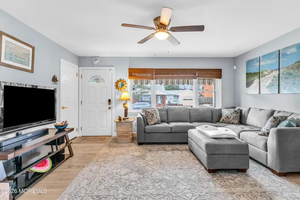 a living room with furniture and a flat screen tv
