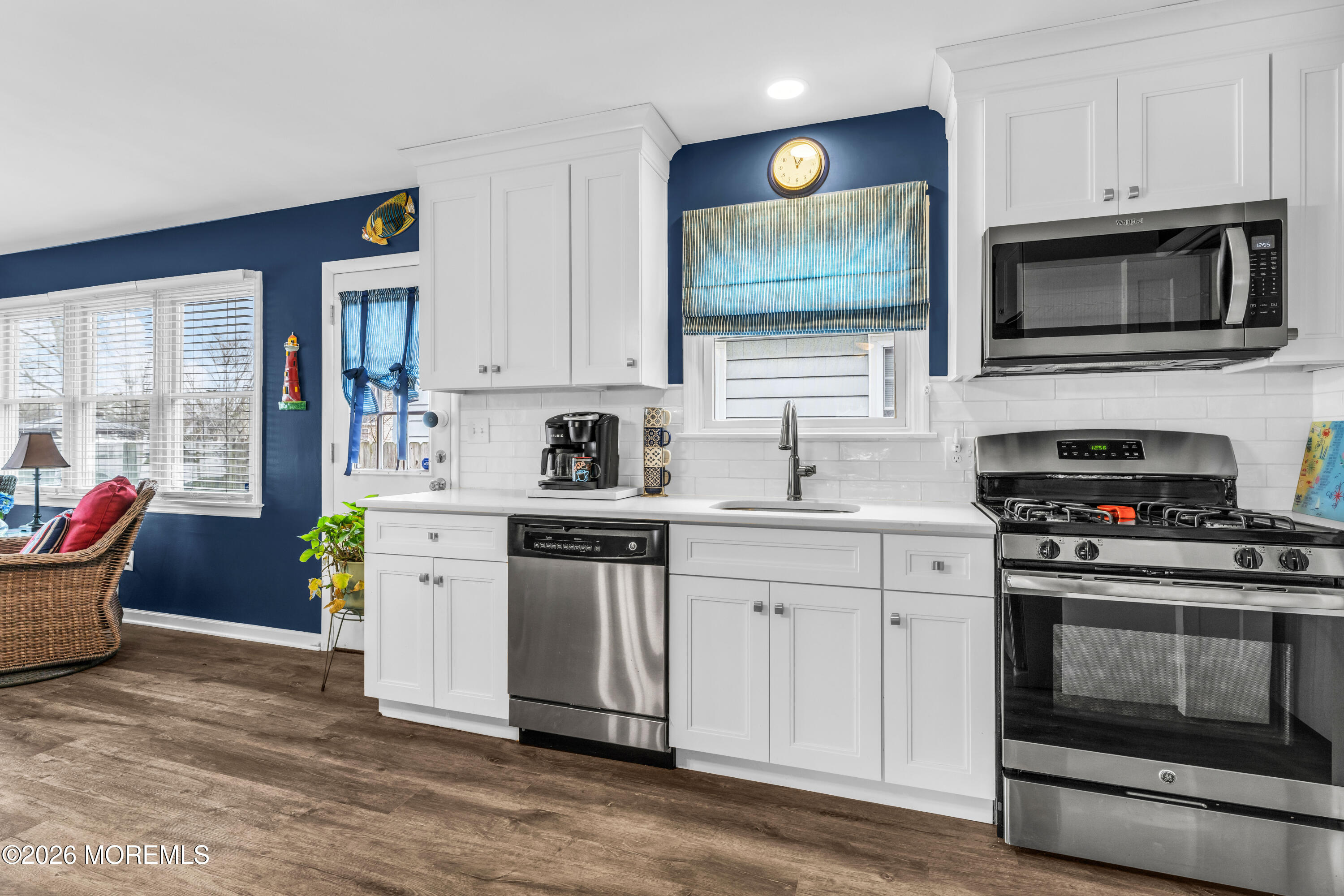 527 Delaware Avenue Point Pleasant, NJ 08742 - Photo 8 of 27 a kitchen with stainless steel appliances a stove microwave and sink
