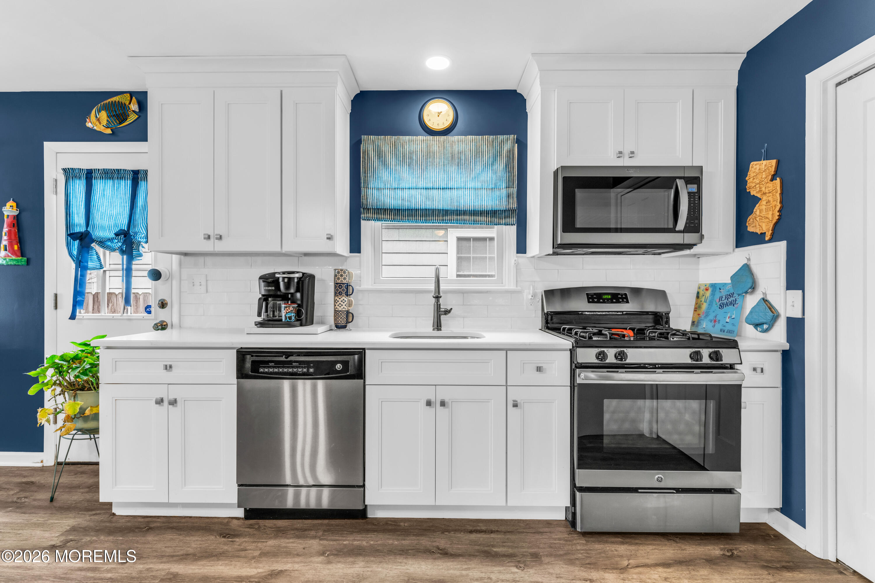 527 Delaware Avenue Point Pleasant, NJ 08742 - Photo 9 of 27 a kitchen with stainless steel appliances granite countertop a stove and cabinets