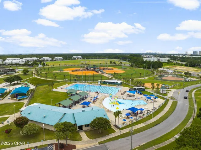an aerial view of a house with a ocean view