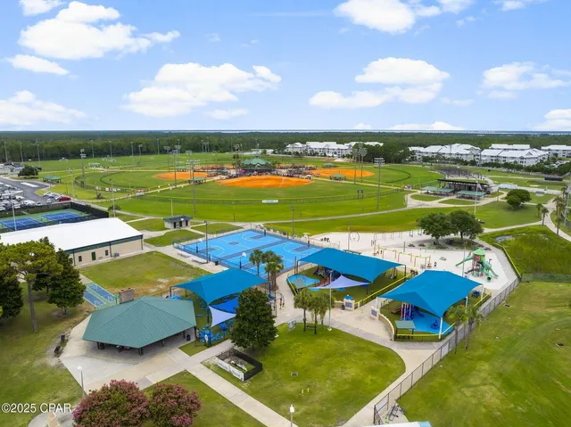an aerial view of a pool yard patio and outdoor seating